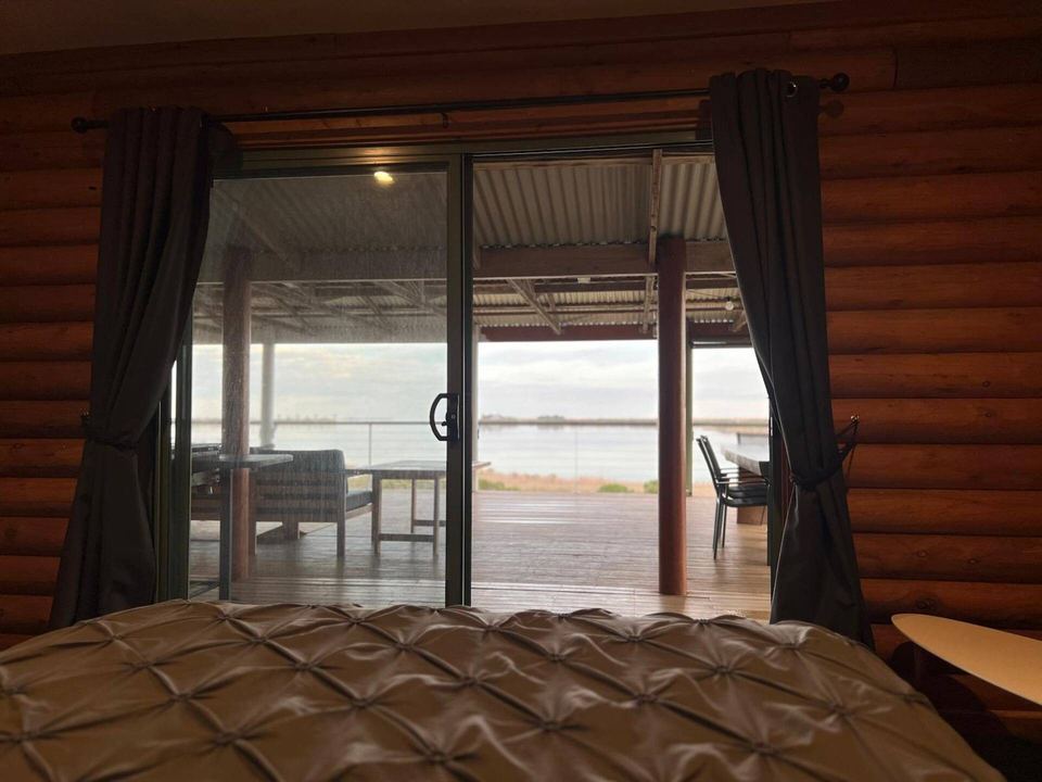 Bedroom opening towards the water