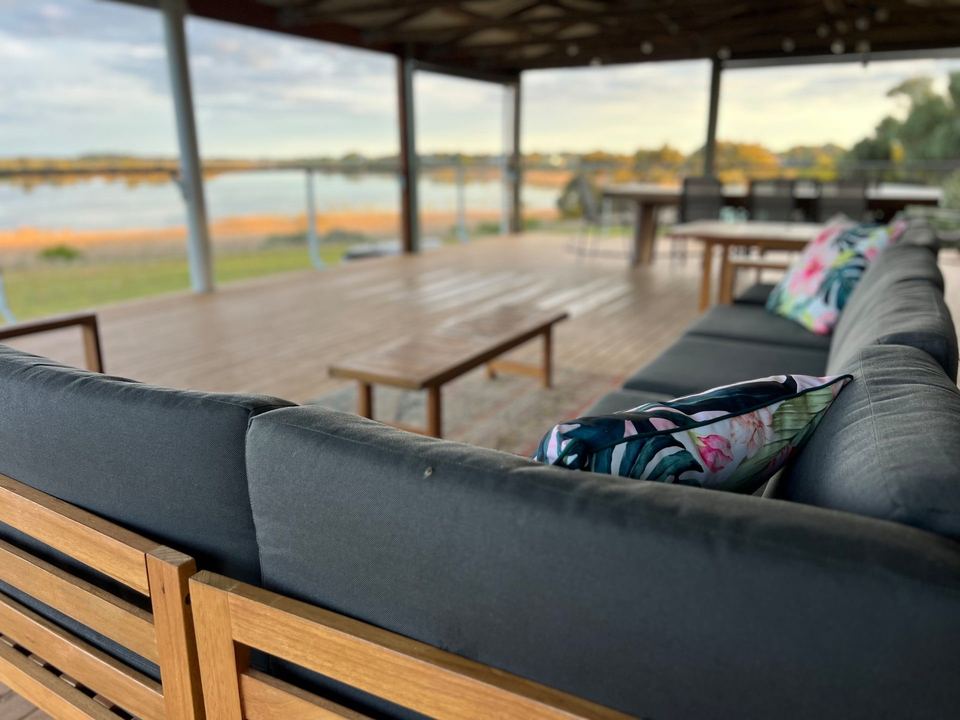 Lounge on the covered deck overlooking the lake