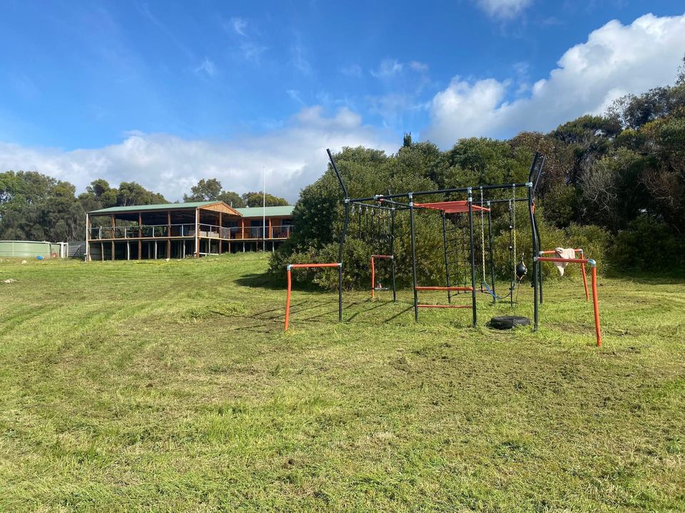 Playground and lawn in front of the house