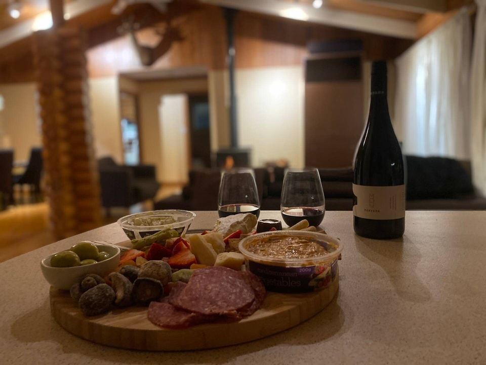 Local wine and a grazing platter by the window